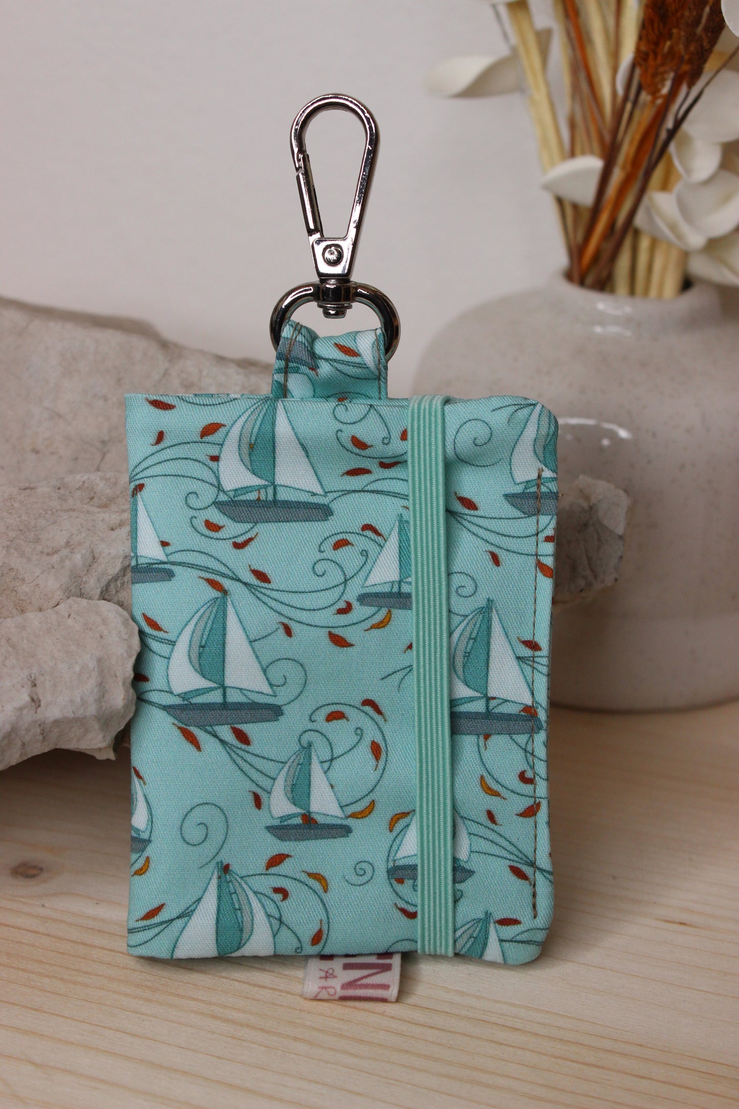 Porta carte con gancio